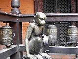 Kathmandu Patan Golden Temple 09 Monkey Statue To Left of Entrance